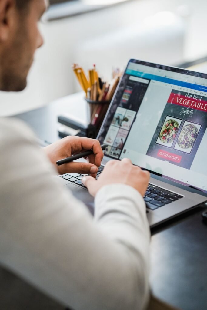 Graphic designer working at a laptop